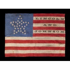 33 STARS IN A “GREAT STAR” PATTERN, ON A SILK ANTIQUE AMERICAN FLAG MADE FOR THE 1864 PRESIDENTIAL CAMPAIGN MADE FOR THE 1864 PRESIDENTIAL CAMPAIGN OF ABRAHAM LINCOLN AND ANDREW JOHNSON, ONE OF THREE KNOWN EXAMPLES IN THIS STYLE