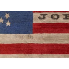 33 STARS IN A “GREAT STAR” PATTERN, ON A SILK ANTIQUE AMERICAN FLAG MADE FOR THE 1864 PRESIDENTIAL CAMPAIGN MADE FOR THE 1864 PRESIDENTIAL CAMPAIGN OF ABRAHAM LINCOLN AND ANDREW JOHNSON, ONE OF THREE KNOWN EXAMPLES IN THIS STYLE