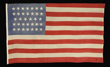 34 STAR, CIVIL WAR PERIOD (1861-63), A PRESS-DYED, MERINO WOOL FLAG WITH A HAND-SEWN COTTON HOIST AND GREAT, DUSTY BLUE COLORATION