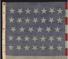 34 STAR, CIVIL WAR PERIOD (1861-63), A PRESS-DYED,  MERINO WOOL FLAG WITH A HAND-SEWN COTTON HOIST AND GREAT, DUSTY BLUE COLORATION