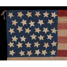 34 STAR, HAND-SEWN, HOMEMADE, ANTIQUE AMERICAN FLAG OF THE CIVIL WAR PERIOD, MADE OF A COMBINATION OF SALVAGED FABRICS, INCLUDING MENS' SHIRTING, 1861-1863, OPENING YEARS OF THE WAR, REFLECTS THE ADDITION OF KANSAS