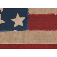 34 STAR, HAND-SEWN, HOMEMADE, ANTIQUE AMERICAN FLAG OF THE CIVIL WAR PERIOD, MADE OF A COMBINATION OF SALVAGED FABRICS, INCLUDING MENS' SHIRTING, 1861-1863, OPENING YEARS OF THE WAR, REFLECTS THE ADDITION OF KANSAS