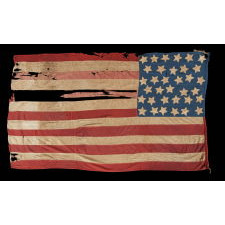 34 STAR, HAND-SEWN, HOMEMADE, ANTIQUE AMERICAN FLAG OF THE CIVIL WAR PERIOD, MADE OF A COMBINATION OF SALVAGED FABRICS, INCLUDING MENS' SHIRTING, 1861-1863, OPENING YEARS OF THE WAR, REFLECTS THE ADDITION OF KANSAS