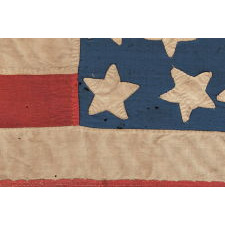 34 STAR, HAND-SEWN, HOMEMADE, ANTIQUE AMERICAN FLAG OF THE CIVIL WAR PERIOD, MADE OF A COMBINATION OF SALVAGED FABRICS, INCLUDING MENS' SHIRTING, 1861-1863, OPENING YEARS OF THE WAR, REFLECTS THE ADDITION OF KANSAS