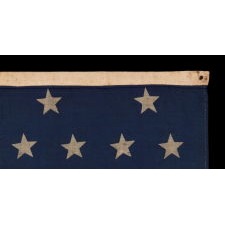 34 STARS IN 4 ROWS WITH 2 STARS OFFSET AT THE HOIST END, LIKELY A UNION ARMY CAMP COLORS, ONE OF ONLY THREE EXAMPLES I HAVE ENCOUNTERED IN THIS EXACT STYLE, OPENING TWO YEARS OF THE CIVIL WAR, 1861-1863, REFLECTS THE PERIOD WHEN KANSAS WAS THE MOST RECENT STATE TO JOIN THE UNION