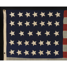 34 STARS ON AN ANTIQUE AMERICAN FLAG OF THE CIVIL WAR PERIOD, MADE BY WILLIAM G. MINTZER IN PHILADELPHIA, PENNSYLVANIA, 1861-63, REFLECTS KANSAS STATEHOOD