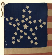 34 STARS, A CIVIL WAR FLAG IN THE "GREAT STAR" OR "GREAT FLOWER" PATTERN, HANDED DOWN THROUGH THE JOHNSON-SCUDDER FAMILY OF OSWEGO COUNTY, WITH VERBAL HISTORY THAT IT WAS CARRIED BY A LOCAL VOLUNTEER UNIT