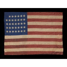 34 STARS, CIVIL WAR PERIOD, PRINTED ON A WOOL BLENDED FABRIC, RARE NOTCHED DESIGN WITH TILTED STARS, POSSIBLY A UNION ARMY CAMP COLORS