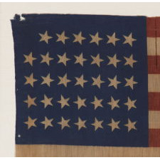 34 STARS, CIVIL WAR PERIOD, PRINTED ON A WOOL BLENDED FABRIC, RARE NOTCHED DESIGN WITH TILTED STARS, POSSIBLY A UNION ARMY CAMP COLORS