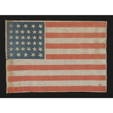 34 STARS, A CIVIL WAR PERIOD PARADE FLAG WITH SCATTERED STAR POSITIONING, KANSAS STATEHOOD, 1861-63