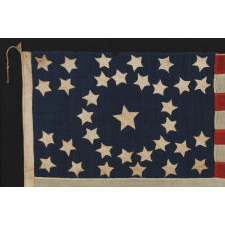 34 STARS, IN A CONFIGURATION THAT IS UNIQUE TO THIS SMALL SCALE, CIVIL WAR FLAG, WITH SUBSTANTIAL FOLK ART QUALITIES, 1861-63, KANSAS STATEHOOD