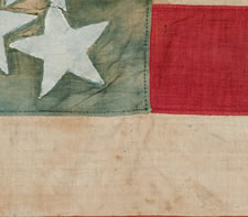 34 STARS IN A CROSS MEDALLION PATTERN THAT IS UNIQUE TO THIS FLAG, CIVIL WAR PERIOD, 1861-63 ENTIRELY HAND-SEWN, WITH WHITE-PAINTED STARS