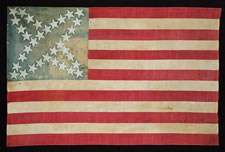 34 STARS IN A CROSS MEDALLION PATTERN THAT IS UNIQUE TO THIS FLAG, CIVIL WAR PERIOD, 1861-63 ENTIRELY HAND-SEWN, WITH WHITE-PAINTED STARS