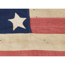 34 STARS, AN ENTIRELY HAND-SEWN CIVIL WAR PERIOD FLAG IN AN EXTRAORDINARY SMALL SIZE FOR THE PERIOD, 1861-63, KANSAS STATEHOOD