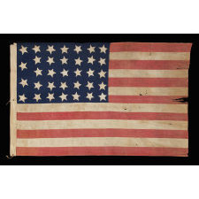 34 STARS, AN ENTIRELY HAND-SEWN CIVIL WAR PERIOD FLAG IN AN EXTRAORDINARY SMALL SIZE FOR THE PERIOD, 1861-63, KANSAS STATEHOOD