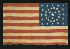 34 STARS IN AN EXCEPTIONALLY RARE CIRCLE-IN-A-SQUARE CONFIGURATION, WITH A "Y" OF STARS IN THE CENTER;  ONE OF ONLY TWO AMONG KNOWN EXAMPLES, PROBABLY A UNION ARMY CAMP COLORS;  1861-1863, OPENING TWO YEARS OF THE CIVIL WAR