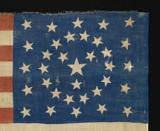 34 STARS IN AN EXCEPTIONALLY RARE CIRCLE-IN-A-SQUARE CONFIGURATION, WITH A "Y" OF STARS IN THE CENTER;  ONE OF ONLY TWO AMONG KNOWN EXAMPLES, PROBABLY A UNION ARMY CAMP COLORS;  1861-1863, OPENING TWO YEARS OF THE CIVIL WAR