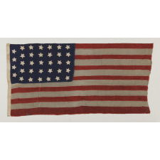 34 STARS ON A HOMEMADE AND ENTIRELY HAND-SEWN FLAG OF THE CIVIL WAR PERIOD, THE SMALLEST I HAVE EVER ENCOUNTERED AMONG PIECED-AND-SEWN WOOL EXAMPLES, AN EXTRAORDINARY FIND, 1861-63, KANSAS STATEHOOD