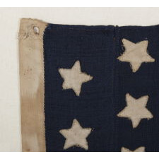 34 STARS ON A HOMEMADE AND ENTIRELY HAND-SEWN FLAG OF THE CIVIL WAR PERIOD, THE SMALLEST I HAVE EVER ENCOUNTERED AMONG PIECED-AND-SEWN WOOL EXAMPLES, AN EXTRAORDINARY FIND, 1861-63, KANSAS STATEHOOD