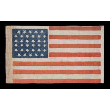 34 STARS IN A LINEAL ARRANGEMENT THAT RESULTS IN A CONFIGURATION THAT I HAVE TERMED "GLOBAL ROWS," ON AN ANTIQUE AMERICAN FLAG MADE DURING THE OPENING TWO YEARS OF THE CIVIL WAR, 1861-63, KANSAS STATEHOOD