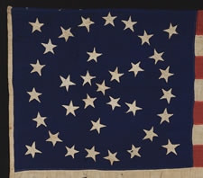 34 STARS IN A RARE AND BEAUTIFUL SNOWFLAKE OR STARBURST MEDALLION, A PRESENTATION BATTLE FLAG MADE BY THE LADIES OF LOMBARD, ILLINOIS FOR THE 8TH ILLINOIS CAVALRY, ONE OF THE HARDEST FIGHTING REGIMENTS OF THE CIVIL WAR, WITH PROBABLE PRO-UNION SYMBOLISM,