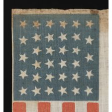 34 STARS, WITH SCATTERED POSITIONING, ON AN ANTIQUE AMERICAN PARADE FLAG MADE DURING THE OPENING TWO YEARS OF THE CIVIL WAR, 1861-63, KANSAS STATEHOOD