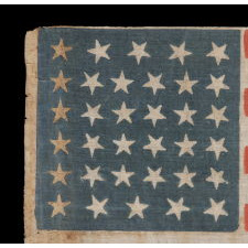 34 STARS, WITH SCATTERED POSITIONING, ON AN ANTIQUE AMERICAN PARADE FLAG MADE DURING THE OPENING TWO YEARS OF THE CIVIL WAR, 1861-63, KANSAS STATEHOOD