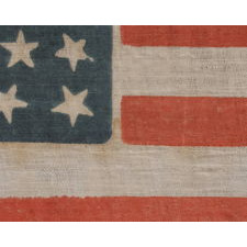 34 STARS, WITH SCATTERED POSITIONING, ON AN ANTIQUE AMERICAN PARADE FLAG MADE DURING THE OPENING TWO YEARS OF THE CIVIL WAR, 1861-63, KANSAS STATEHOOD