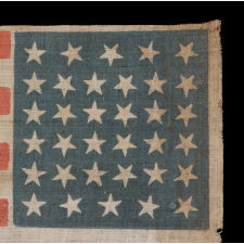 34 STARS, WITH SCATTERED POSITIONING, ON AN ANTIQUE AMERICAN PARADE FLAG MADE DURING THE OPENING TWO YEARS OF THE CIVIL WAR, 1861-63, KANSAS STATEHOOD