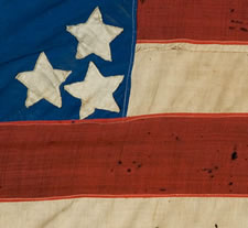 34 STARS IN A VARIATION OF THE "GREAT STAR" CONFIGURATION, CANTON RESTING ON THE WAR STRIPE, PROBABLY A CIVIL WAR PRESENTATION BATTLE FLAG, 1861-63