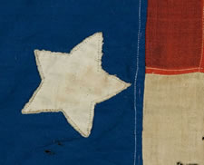 34 STARS IN A VARIATION OF THE "GREAT STAR" CONFIGURATION, CANTON RESTING ON THE WAR STRIPE, PROBABLY A CIVIL WAR PRESENTATION BATTLE FLAG, 1861-63