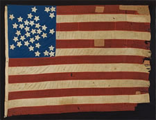 34 STARS IN A VARIATION OF THE "GREAT STAR" CONFIGURATION, CANTON RESTING ON THE WAR STRIPE, PROBABLY A CIVIL WAR PRESENTATION BATTLE FLAG, 1861-63