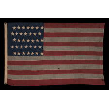 35 STAR ANTIQUE AMERICAN FLAG OF THE CIVIL WAR PERIOD, IN A DESIRABLE SMALL SCALE AMONG ITS COUNTERPARTS, REFLECTS THE TIME DURING WHICH WEST VIRGINIA WAS THE MOST RECENT STATE TO JOIN THE UNION, 1863-1865