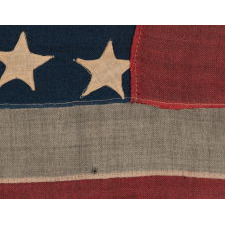 35 STAR ANTIQUE AMERICAN FLAG OF THE CIVIL WAR PERIOD, IN A DESIRABLE SMALL SCALE AMONG ITS COUNTERPARTS, REFLECTS THE TIME DURING WHICH WEST VIRGINIA WAS THE MOST RECENT STATE TO JOIN THE UNION, 1863-1865