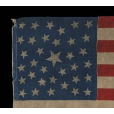 35 STARS, PROBABLY A CIVIL WAR CAMP COLORS, WEST VIRGINIA STATEHOOD, 1863-1865, ONE OF A TINY HANDFUL OF PRESS-DYED WOOL FLAGS WITH A RANDOM CONFIGURATION OF STARS