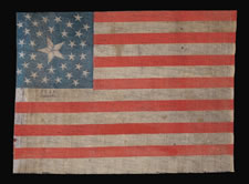 35 STARS, USED IN THE 1868 PRESIDENTIAL CAMPAIGN OF ULYSSES S. GRANT, A RARE, MEDALLION PATTERN PARADE FLAG WITH A LARGE, PIE-CUT CENTER STAR AND TWO STARS IN EACH CORNER, PRODUCED IN THE CIVIL WAR PERIOD, 1863-65