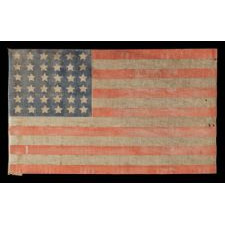 36 STAR ANTIQUE AMERICAN PARADE FLAG OF THE CIVIL WAR ERA, IN AN ESPECIALLY LARGE SCALE AND WITH ENDEARING WEAR, 1864-67, NEVADA STATEHOOD