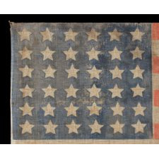 36 STAR ANTIQUE AMERICAN PARADE FLAG OF THE CIVIL WAR ERA, IN AN ESPECIALLY LARGE SCALE AND WITH ENDEARING WEAR, 1864-67, NEVADA STATEHOOD