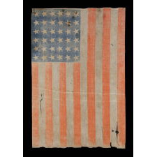 36 STAR ANTIQUE AMERICAN PARADE FLAG OF THE CIVIL WAR ERA, IN AN ESPECIALLY LARGE SCALE AND WITH ENDEARING WEAR, 1864-67, NEVADA STATEHOOD