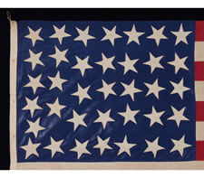 36 STARS ON A BEAUTIFUL GLAZED COTTON CANTON (COTTON CHINTZ), ENTIRELY HAND-SEWN, CIVIL WAR ERA, 1864-1867, IN A GREAT, SMALL SIZE, A HOMEMADE EXAMPLE