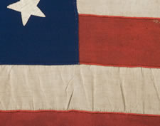 36 STARS IN A MEDALLION CONFIGURATION ON AN ENTIRELY HAND-SEWN FLAG WITH A BEAUTIFULLY ELONGATED FORMAT, CIVIL WAR ERA, 1864-67, NEVADA STATEHOOD