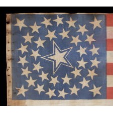 36 STARS IN A MEDALLION CONFIGURATION ON A PARADE FLAG WITH A HUGE, HALOED CENTER STAR; A RARE EXAMPLE, LARGE IN SCALE, CIVIL WAR ERA, NEVADA STATEHOOD, 1864-67