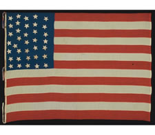 36 STARS, POSSIBLY WITH ONE STAR ADDED, CIVIL WAR ERA, 1863-1867,ENTIRELY HAND-SEWN, A HOMEMADE EXAMPLE IN THE STYLE OF A UNION BATTLE FLAG, WITH A TALL AND NARROW CANTON