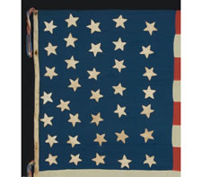 36 STARS, POSSIBLY WITH ONE STAR ADDED, CIVIL WAR ERA, 1863-1867,ENTIRELY HAND-SEWN, A HOMEMADE EXAMPLE IN THE STYLE OF A UNION BATTLE FLAG, WITH A TALL AND NARROW CANTON