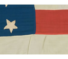 36 STARS, POSSIBLY WITH ONE STAR ADDED, CIVIL WAR ERA, 1863-1867,ENTIRELY HAND-SEWN, A HOMEMADE EXAMPLE IN THE STYLE OF A UNION BATTLE FLAG, WITH A TALL AND NARROW CANTON