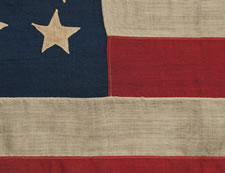 37 HAND-SEWN, SINGLE- APPLIQUED STARS ON A FLAG WITH SMALLER THAN USUAL DIMENSIONS FOR THE PERIOD, 1867-1876, NEBRASKA STATEHOOD