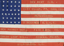 37 STAR, SILK PARADE FLAG WITH GOLD-PAINTED, HAND-STENCILED BATTLE HONORS OF THE 5TH OHIO COLORED INFANTRY, FOUND AMONG THE POSSESSIONS OF COMMANDING OFFICER, COL. JAMES M. CONINE