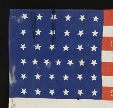 37 STAR, SILK PARADE FLAG WITH GOLD-PAINTED, HAND-STENCILED BATTLE HONORS OF THE 5TH OHIO COLORED INFANTRY, FOUND AMONG THE POSSESSIONS OF COMMANDING OFFICER, COL. JAMES M. CONINE