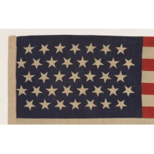 37 STARS IN A "DANCING" OR "TUMBLING" ORIENTATION ON AN ANTIQUE AMERICAN FLAG WITH ELONGATED PROPORTIONS, NEBRASKA STATEHOOD, 1867-1876, THE ERA OF AMERICAN RECONSTRUCTION