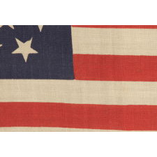 37 STARS IN A "DANCING" OR "TUMBLING" ORIENTATION ON AN ANTIQUE AMERICAN FLAG WITH ELONGATED PROPORTIONS, NEBRASKA STATEHOOD, 1867-1876, THE ERA OF AMERICAN RECONSTRUCTION